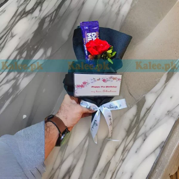 A single red rose bouquet paired with Dairy Milk chocolates.