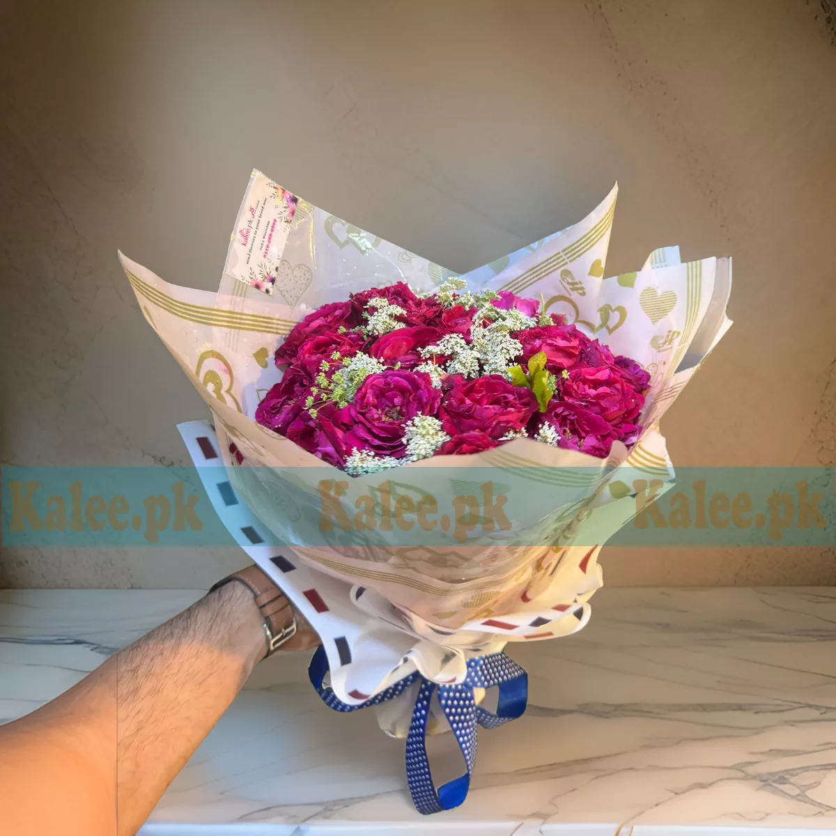 A stunning Roses Flowers Bouquet featuring fresh roses and delicate statice flowers for an elegant floral arrangement.