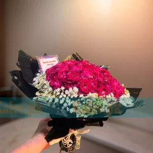 A breathtaking 100 Red Roses Bouquet wrapped in elegant lacy lace for a luxurious floral gift.