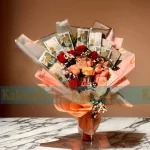 A unique Currency Notes Bouquet combined with fresh roses and baby’s breath for a thoughtful and elegant gift.