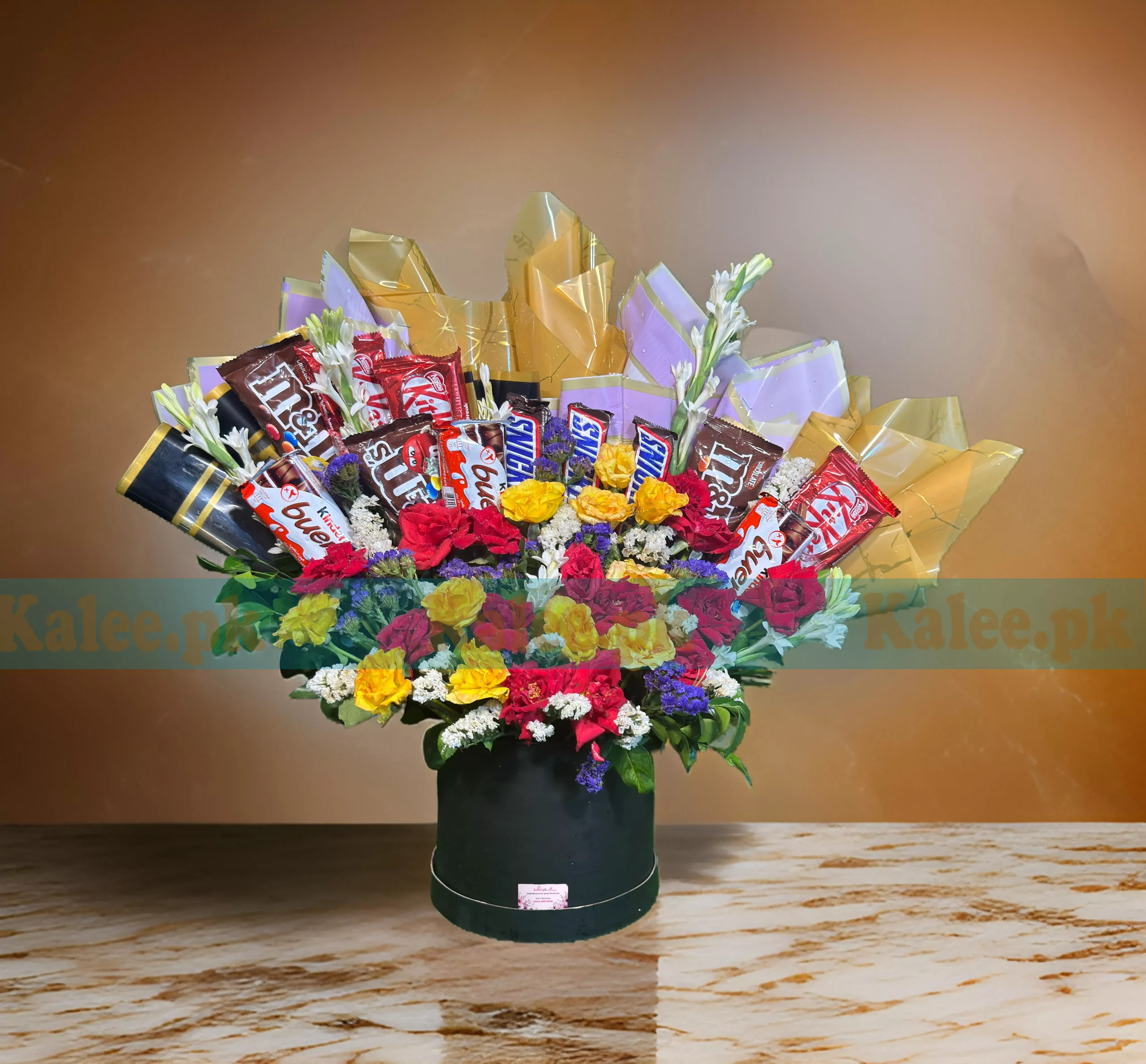 Containing chocolates and colorful Mixed Flowers Box.