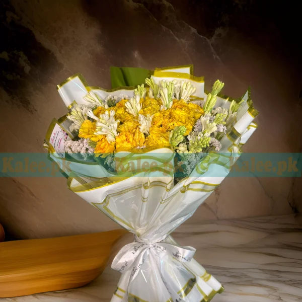 A bouquet of yellow roses with tuberose flowers.