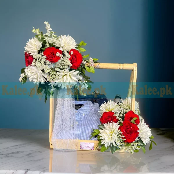 A gift basket filled with mixed flowers in an elegant arrangement.