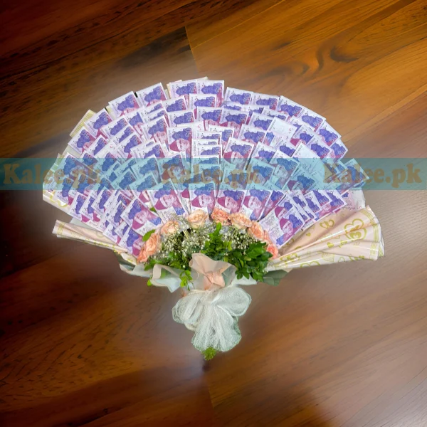 A bouquet combining currency notes, pink roses, and baby's breath flowers.