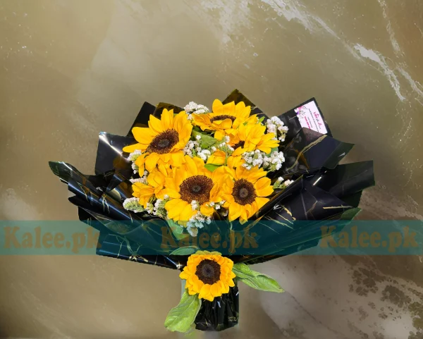 A stunning bouquet of imported sunflowers with statice flowers.