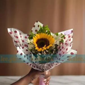 A bouquet of imported Sunflower with Statice and tuberose flowers.