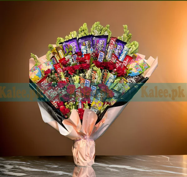 A fully loaded bouquet with chocolates and a variety of mixed flowers.