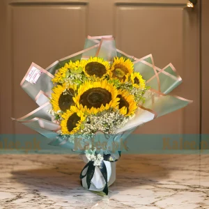 A bouquet of imported sunflowers with baby's breath flowers.