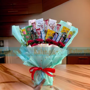 A luxury fancy bouquet with chocolates and an assortment of flowers.