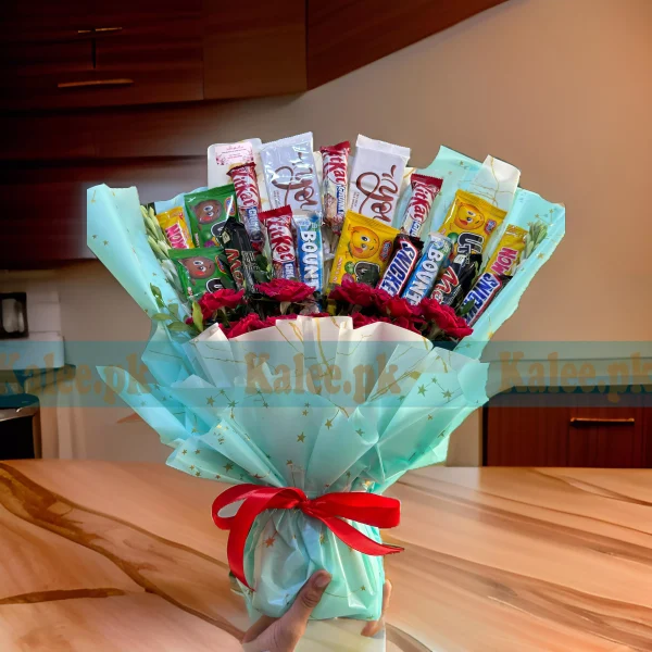 A luxury fancy bouquet with chocolates and an assortment of flowers.