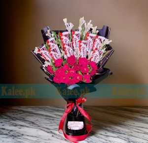 Kinder Chocolates Bouquet with fresh red roses, elegantly wrapped with a satin ribbon.