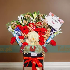 A charming Flowers Box with Chocolates and a cute teddy bear, perfect for gifting.