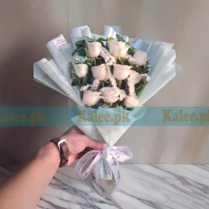 A Flowers Glorious Bouquet featuring white roses and statice flowers, offering a graceful and timeless floral arrangement.