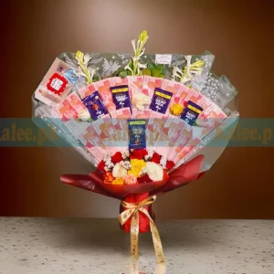 A delightful bouquet of chocolates and flowers, with 100 rupee cash currency tucked in, making it a perfect gift for special occasions.