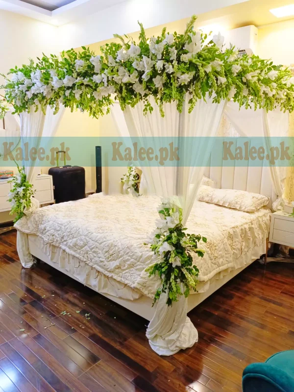 Wedding bridal bedroom decor with fresh white gladiolus and tuberose flowers for a romantic and elegant ambiance.