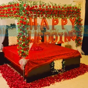 Red rose flowers arranged for a beautiful wedding bridal bedroom decoration.