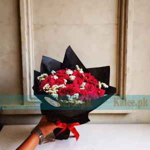 A stunning Bouquet with Roses, elegantly wrapped and featuring fresh roses and delicate statice flowers for a refined floral arrangement.