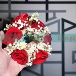 Bridal gajray pair made with red roses and baby’s breath flowers
