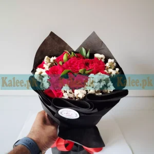 A beautiful Flowers Fancy Bouquet featuring English red roses and statice flowers, elegantly wrapped for a sophisticated presentation.