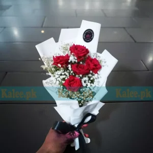 A stunning Flowers Bouquet With Baby's Breath, featuring classic red roses and delicate baby's breath, elegantly wrapped for a timeless gift.