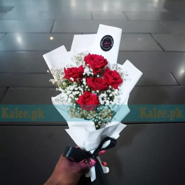 A stunning Flowers Bouquet With Baby's Breath, featuring classic red roses and delicate baby's breath, elegantly wrapped for a timeless gift.