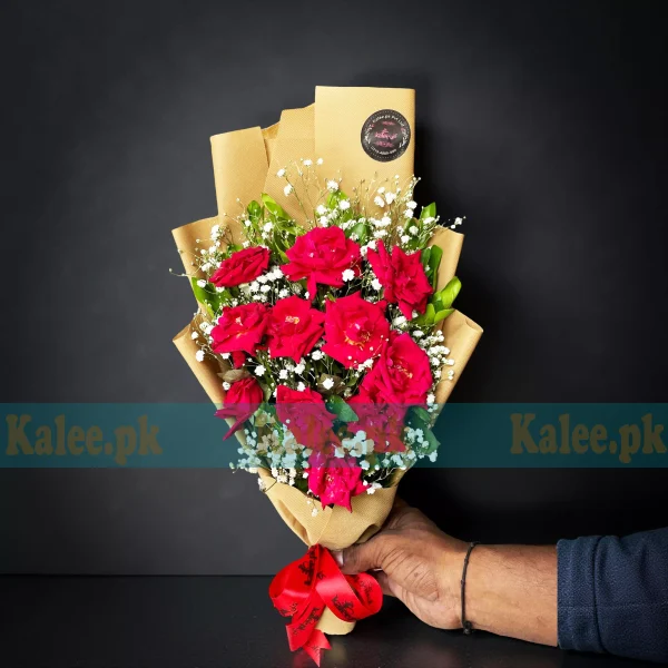 A beautifully arranged Red Rose Bouquet with delicate statice flowers, elegantly wrapped for a stunning presentation.