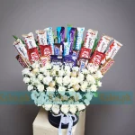 Chocolate Box with white roses, baby’s breath, and assorted premium chocolates – Karachi flower shop Kalee.pk