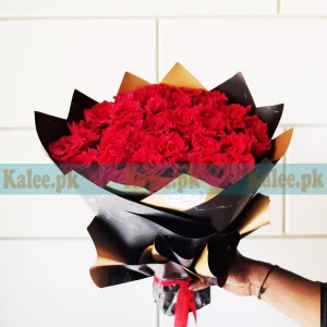 A stunning Flowers Bouquet featuring elegant English red roses wrapped in sleek black paper for a sophisticated touch.